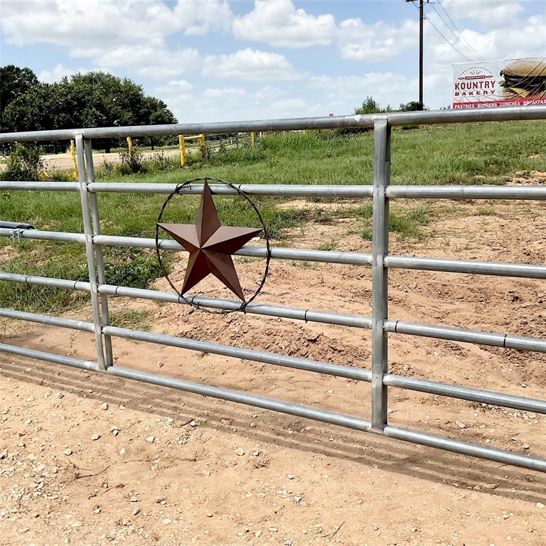 Ready to get away from the hustle & bustle of city life? You've found the perfect place in Hallettsville, TX! This land is fenced and cleared, ready for cattle grazing and includes a cattle pen with well-fed concrete water trough. Property is currently AG exempt. Electricity present and recent electric gate installed, well maintenance and repairs have been done. Aerobic septic system newly installed. 103' X 32' slab has been plumbed and poured, 35' X 32' adjacent garage slab poured as well. Plans are available or retro fit and design your own dream home. What can you dream up?