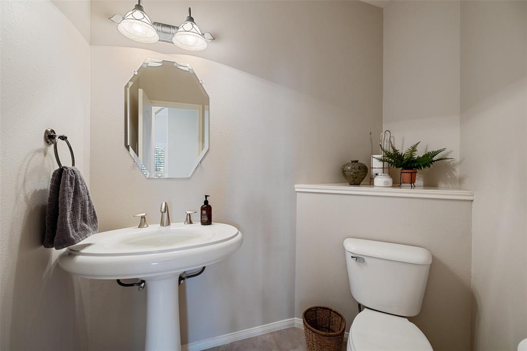 This half bath for guests is conveniently located off the main living area.