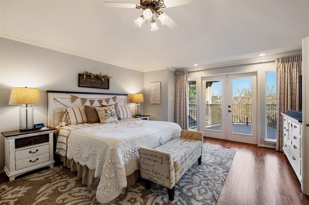 The large primary bedroom is located off of 1 of 3 balconies and has gorgeous views of Little Thicket Park. It also includes a raised ceiling and wood floors.