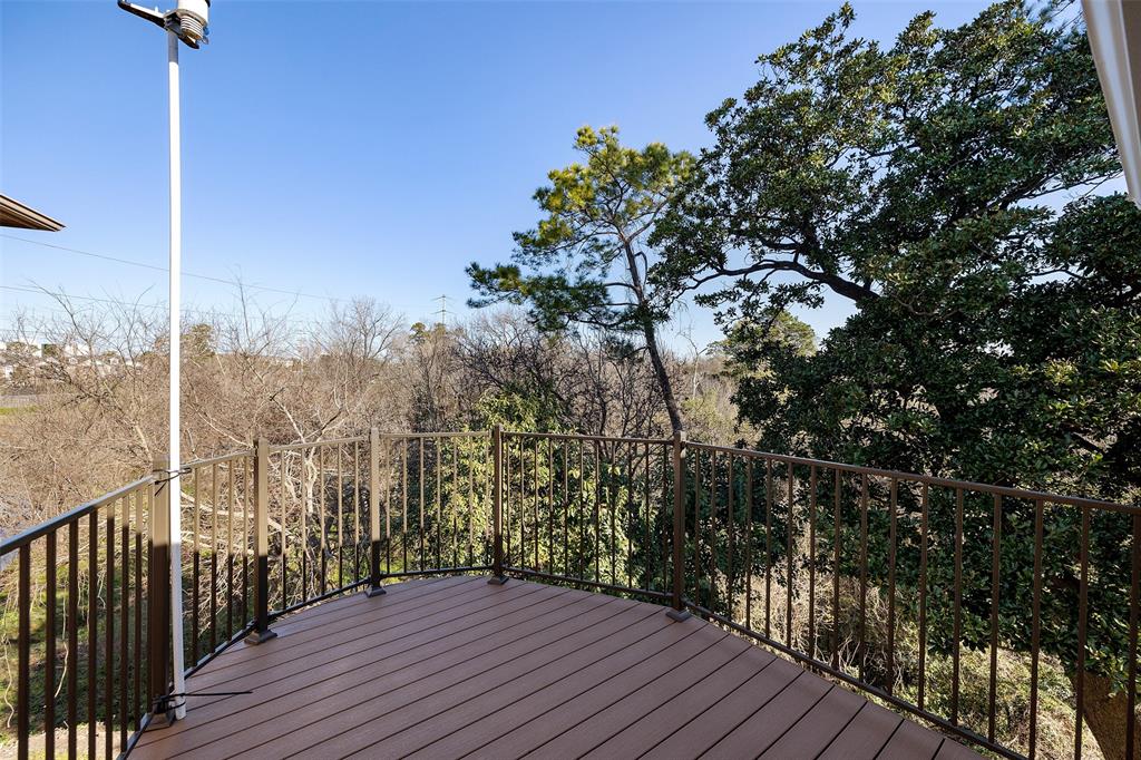This balcony is located right off the primary bedroom and overlooks gorgeous Little Thicket Park. You'll love starting your day amongst the tree tops.