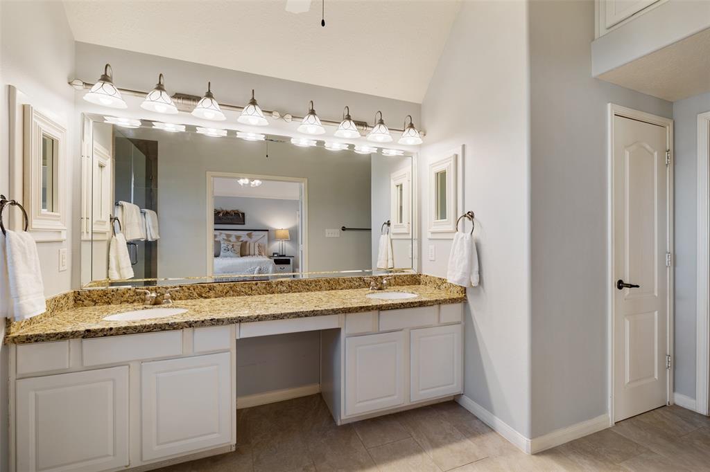 The master suite also includes a large vanity with double sinks and a large walk-in closet.