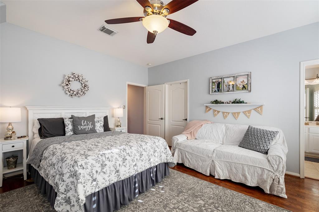 This large secondary bedroom is located near the primary bedroom. It includes hardwood floors and generous closet space.