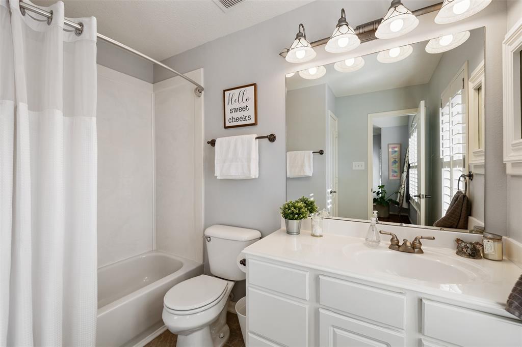 This en suite bathroom is located just off the upstairs secondary bedroom.