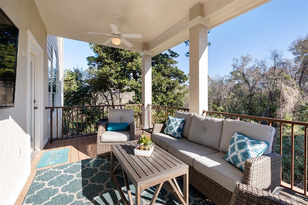 Whether you want to dine outside, watch the big game, sip coffee before starting you day, or just let the dog out, this home has an outdoor space for every occasion. This balcony is located just off the main living area and provides a great space to relax and watch TV in the afternoon or weekends. It also overlooks Little Thicket Park.