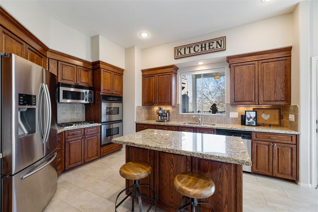 The chef in your family is going to love this gorgeous center island kitchen, which includes tons of cabinetry, granite counter-tops, and a large pantry. Thanks to the double oven and 5 burner gas cook-top, you'll also have plenty of cook space for holiday dinners.