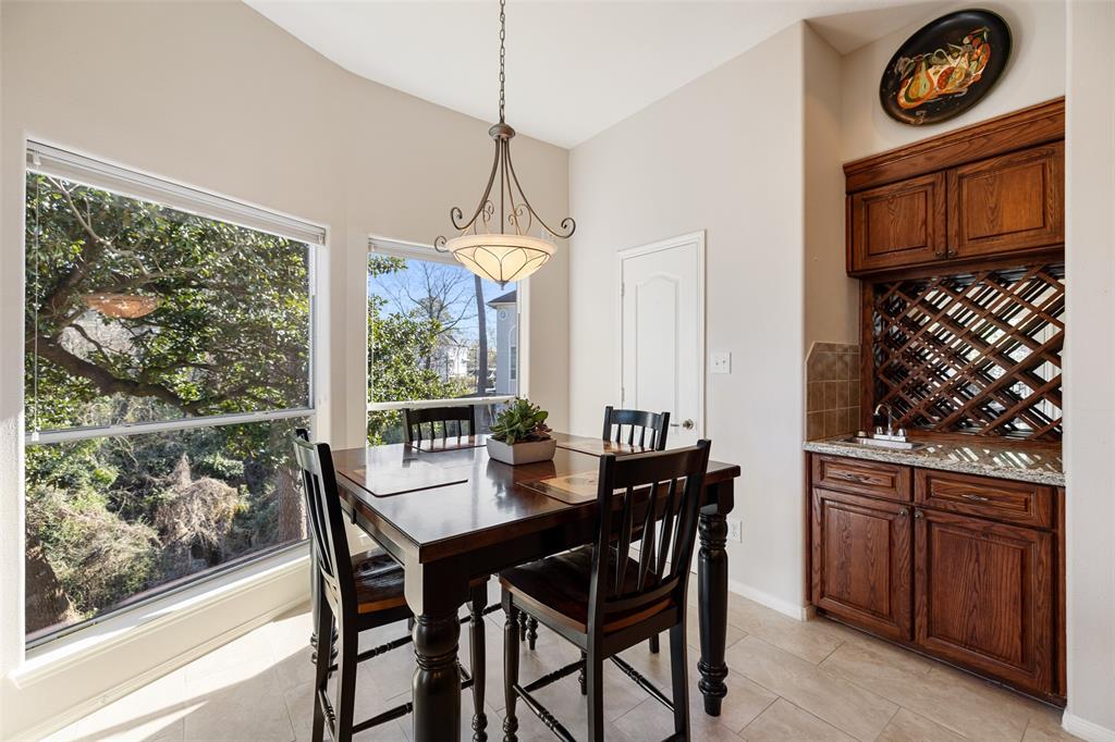 What a wonderful space to start your day. This breakfast room is located just off the kitchen and offers scenic views of Little Thicket Park. This space also includes a wet bar.