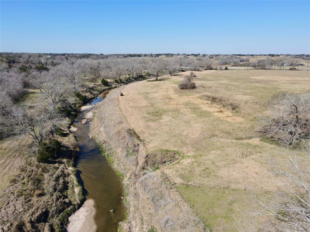 Located in Hallettsville Texas, this 55.34 +/- tract of land is priced to sell, is mostly flat & open with some scattered live oaks with river frontage on the Lavaca River. Bring your travel trailer, dirt bikes & fishing rods. This property would make a great place to get away from the city life on the weekends, recreational properties are hard to find. Abundant deer and other wildlife are attracted to this area because of the Lavaca River, hunting is allowed. The property is currently being used for livestock grazing, has a nice pond, & has an ag exemption on it. The property taxes are very low. Electricity is available. A survey is needed to determine the exact acreage & the price will be adjusted accordingly. The property is located within the 100 year floodplain. No minerals convey. There is additional acreage available also. Located approximately 2 hrs from Houston & San Antonio.