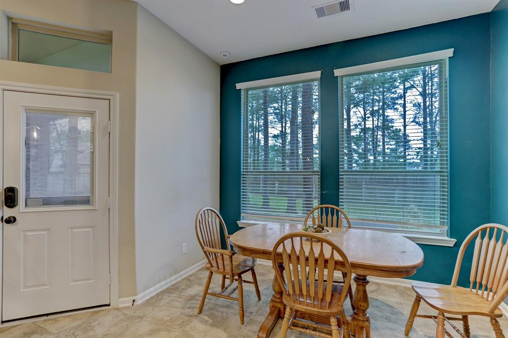 Rear entrance shown as well as the breakfast nook with a great view of the back yard.