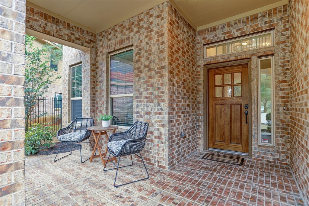 This charming front porch is a great place to catch up with neighbors or watch the kids play in the quiet cul de sac! Upgraded solid wood front door with seeded glass transoms.