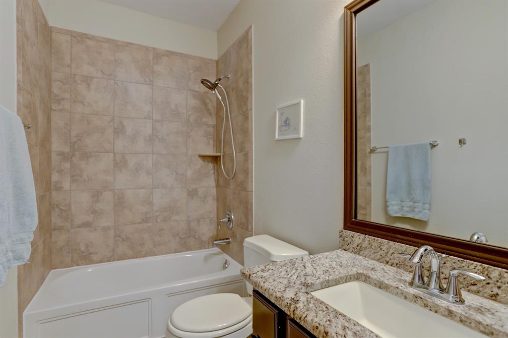 Full bath #2 is located between bedrooms 3 & 4...features granite sink and framed mirror.