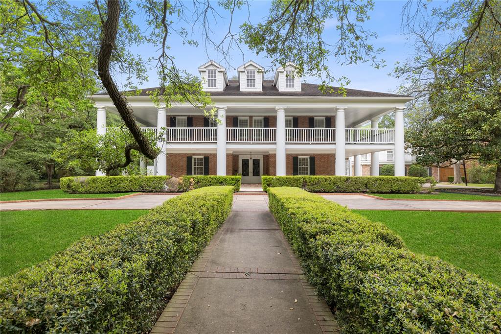 Live on one of Houston's most sought after streets: South Boulevard! The oak-lined ave will lead you to this historic home, which sits on an exceptional 38,295 SF corner lot. The charming brick colonial offers comfortable and functional living. The first floor showcases large formal living room surrounding marble fireplace, bright library with built-in bookshelves and fireplace,  a designated formal dining room, island kitchen and a sunroom. The second floor includes a large primary suite and two additional bedrooms. Remarkable wrap-around porch on second floor makes outdoor/indoor living easy. Additional open concept pool house/game room located behind the home with one bedroom apartment complete with kitchenette and full bath on second floor. A pool house terrace overlooks the pool and yard. Large circle drive at the front of the home with additional parking in rear. Located in the historically preserved subdivision of Broadacres.