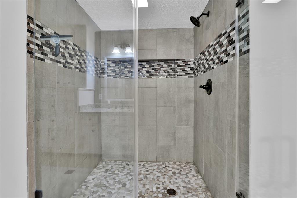 Shower located in primary bathroom.