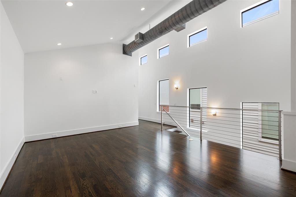 This large gameroom is very versatile. It can be utilized as study, another TV watching area, or a playroom for the kiddos. It also has great natural light from the cased windows. The ceilings on the 2nd floor rise as high as 18 feet in some areas. Hardwood floors stretch throughout most of the 2nd story.