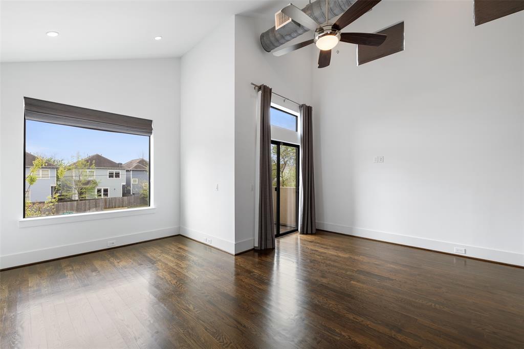 The primary bedroom also offers an extra seating area and outdoor balcony. Like the main living area, the outlets are also tucked way in the baseboards.