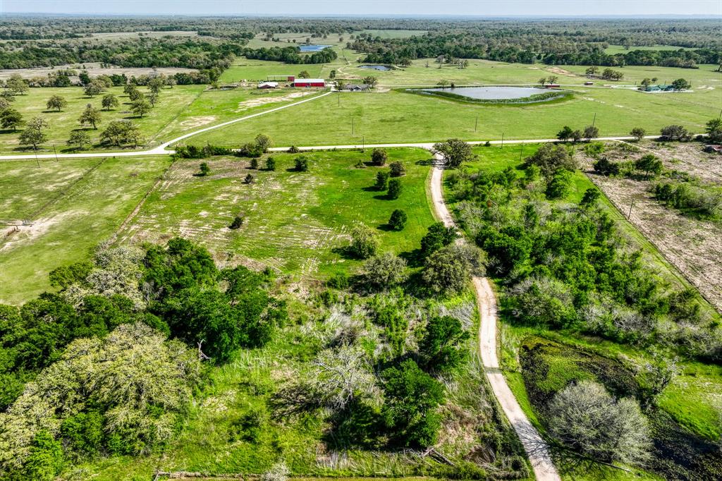 A great piece of land off of CR 201. This land has a nice mixture of open land along with nice, big trees. The touching acreage is being sold as well. Property has recently been shredded and mulched. Only 5 miles from Snook, 20 miles from TAMU. Electric is available. Snook ISD. No restrictions. Come build your forever home or weekend cabin today!