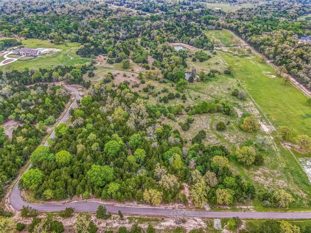 Here's your chance to own almost 10 unrestricted acres IN COLLEGE STATION, right off Stousland Rd and minutes to south College Station amenities. Rare find in COLLEGE STATION to create your country homestead on prime real estate. The lot borders Ashland Preserve Private Estates but is not a part of the HOA or restrictions.