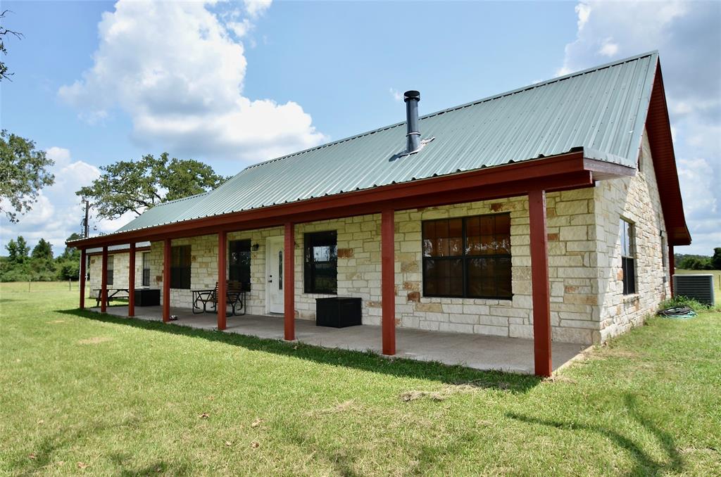 Are you ready to take a deep dive into the heart of Texas? Real country living done right! This rustic 5 bedroom/5bath beauty will definitely impress! The Lodge sleeps minimum 16 comfortably. Primary bedroom is conveniently located downstairs and features a full sized bathroom, double vanity, tub/shower and an oversized closet. 2nd downstairs bedroom has a full bathroom that is open to guests. 3rd and 4th upstairs bedrooms each have their own full private bathroom. The loft upstairs features 2 twins beds. Fifth bedroom/bunk room has plenty of room and encompass 6 twin beds, a dining room table, a refrigerator and a wet bar. Would make for an awesome game room.  There's still plenty room for a pool table or maybe some poker tables... There's plenty of room for your wildest imaginations! This home was built to entertain family's. The fishing and hunting are bountiful, but nothing beats the gorgeous view; like something you would see in an old western movie.  Absolutely breathtaking!!!