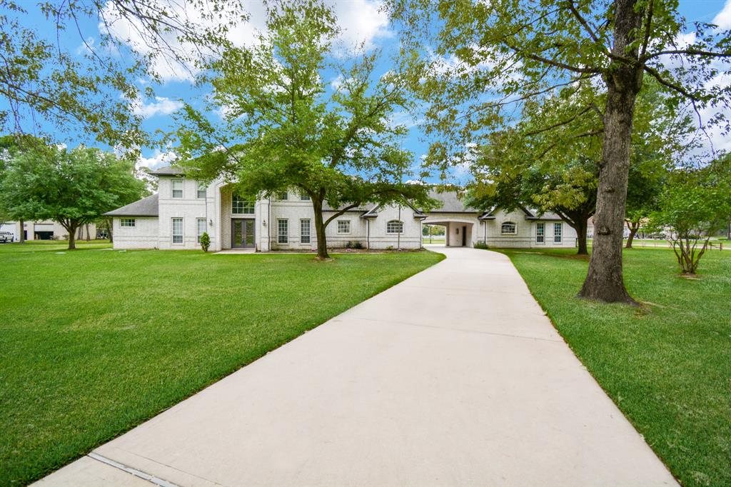 Don't miss your opportunity to own 31002 Johlke now with an adjusted price to make it your dream home. A custom-built sitting on 12.082 acres with a white brick exterior giving a modern look and luxurious interior that features wood-looking tiled floors and high ceilings throughout. The kitchen is truly functional with all the bells & whistles; granite, Stainless Steel appliances, an island with a downdraft gas stove, and under-counter lights. You enter the primary suite from the family room to the formal dining room with its HVAC control for comfort, a nice seating area, and a gracious master bath. Winding up the stairs lies a game room, 3 bedrooms, 2 full baths & another set of return stairs. Close to the cities of Tomball, Magnolia, and Pinehurst via 99 tollway and TX 249, but far enough to live in a tranquil setting allowing for fishing in the stocked pond, equestrian activities, off-road riding, and playing on the basketball court or just relax in your outdoor equipped kitchen.