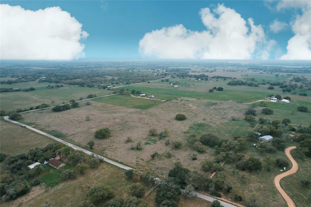 You can have it all! The privacy this 34 acre "gentleman's ranch" will provide but less than 5 miles to town! This is the perfect location to build your dream home and have a few cows and horses! Beautiful homesite locations near the pond or any of the huge century oaks! The rolling hills add to the beauty of this property! There is a cross fence already in place and perimeter fencing is good. If you are ready to get out of the city this is the place - you are less than 2 hours to Houston, Austin, Corpus, or San Antonio. Middle of everywhere but the middle of nowhere! Come to Lavaca County, the heart of the golden triangle, and see what all the hype is about! See why people are moving to our amazing area and what we have to offer!