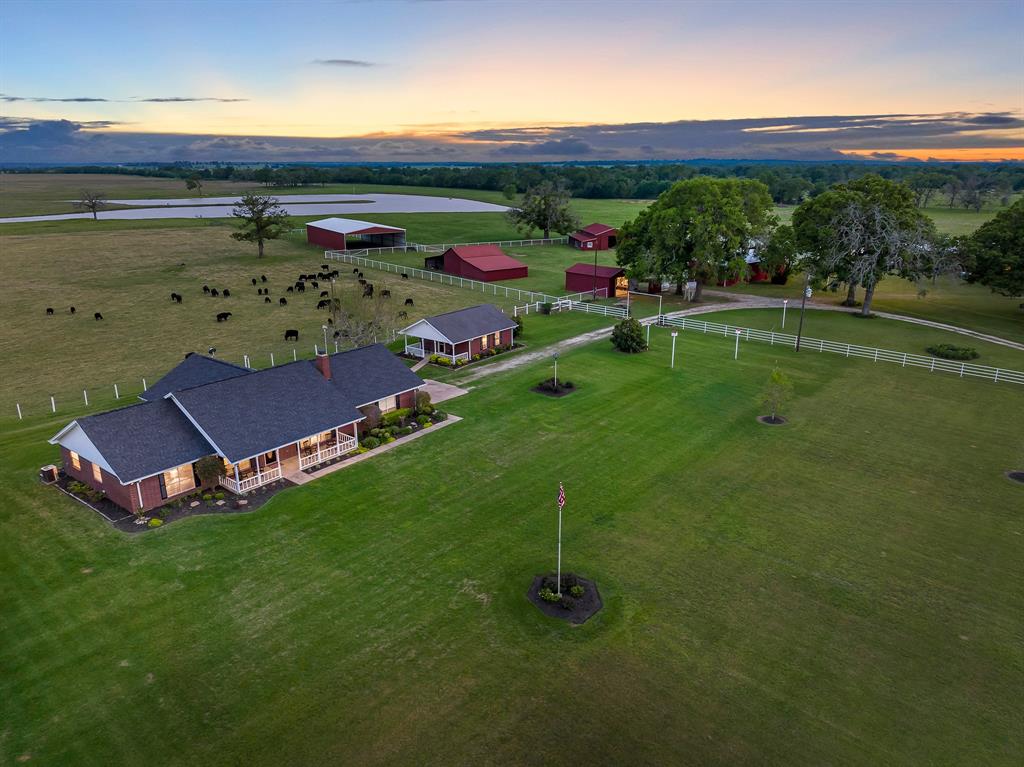 Impressive, Pride of Ownership, attention to every detail & true functionality of your own cattle ranch, leisure ranch, getaway or full time residence! A true turn key opportunity is here off FM 132 just outside of Crockett in the community of Porter Springs! Property features 200 +/- acres, 12 acre stocked lake w/peninsula, 2 ponds, main house is 2,682 sq. ft. w/ large inviting country living front porch, hardwood floors throughout all main areas & bdrms, double ovens, comfortable layout for crowds, full remodel/renovation 2015, Guest House is 625 sq. ft. & is great for even more quests plus full bathroom & private front porch. There is additional living quarters at the main barn w/ full kitchen & bathroom! Cattle/livestock ready w/ 4 catch pens, fenced pastures, Texas size hay barn, multiple out buildings/Barns, & sheds! Wide open spaces, beautiful oak trees & pastures are a site to see and enjoy! Escape the big city here, endless possibilities! Great for Hunting, Farming & more!