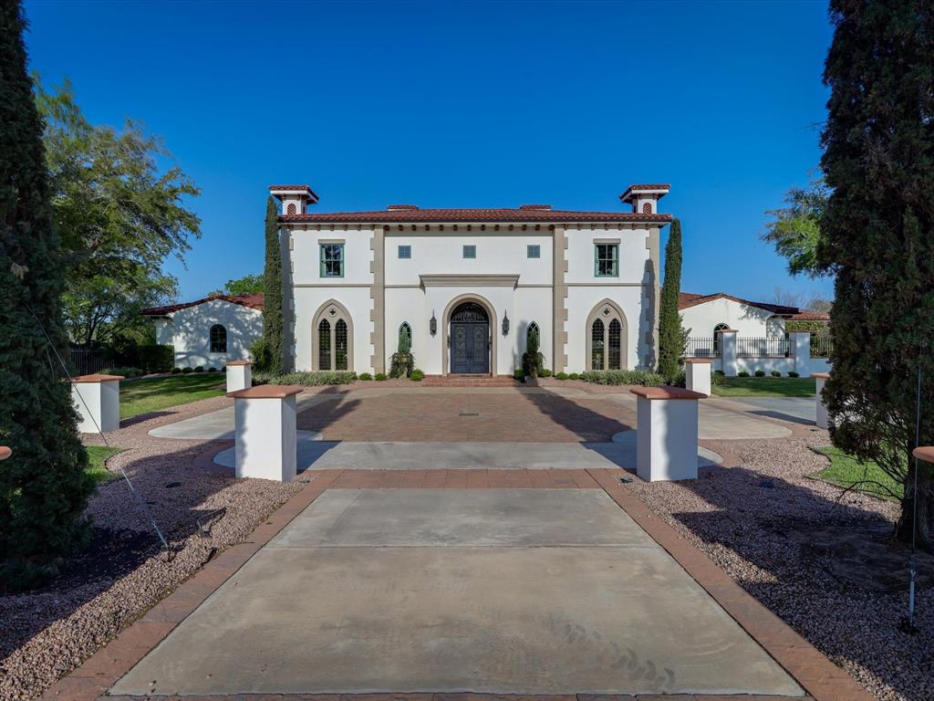 This home is elegant and understated in a true Spanish Colonial Revival style, in immaculate condition, located on six plus acres backing up to Spring Creek.  Inside features include three custom stone fireplaces, hand hewn antique beams, Saltillo flooring with Level 5 drywall throughout, large master's quarters, two separate walk in closets, custom carved wood paneling in bathroom and kitchen.  Formal living and dining rooms contain custom gothic arched windows.  Kitchen includes breakfast area with custom windows, Sub-zero and Wolf appliances in kitchen, copper sinks, quartzite counters.  Walk in pantry and large laundry.  Exterior includes custom iron doors and driveway gates, mature landscaping and lighting, graceful pool with spa.  Summer kitchen with Wolf grill and sink, includes storage and 1/2 bath.  Outdoor chapel which can be used for another purpose, bocce court, labyrinth,  access to Spring Creek on property.  Ivy lined privacy walls between neighbors.  Stunning property.