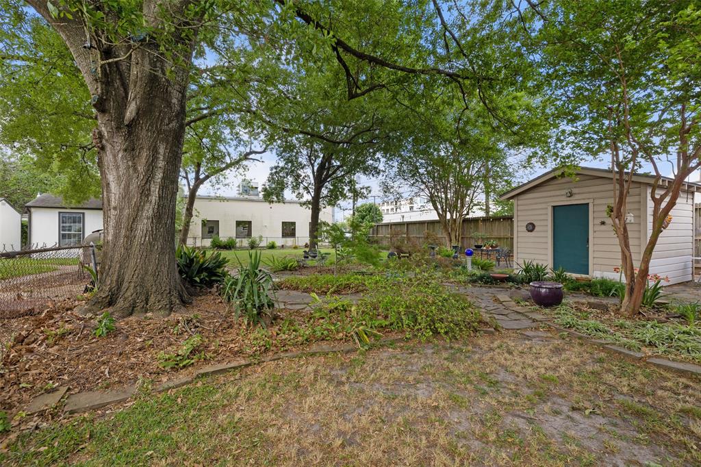 If you are looking to keep the home and possibly renovate, the backyard is beautifully landscaped and includes a garden shed.