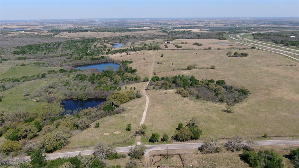 Incredible investment opportunity for land development. Rolling pastures & panoramic views for miles. Located just 12 miles north of Seguin, TX, this prime 340 +/- acre farm offers open pastures, stock ponds & wooded scenery. Can serve cattle ranching, equine, wildlife, residential, or even recreational use. The ranch has paved road frontage with electric gate entrance off FM 20. Rural water available through Crystal Clear Water SUD and electric available through Guadalupe Valley Electric CO-OP. Premier location just off of a major TX tollway (130) and Interstate I-10. Easy access to Austin, Houston & San Antonio. Convenient to Tyson, Catepillar and other commercial hubs. Less than 15 minutes to schools, grocery stores and amenities in Gruene, Martindale, New Braunfels, Luling, Seguin and San Marcos. Prime location for residential community or commercial site. See attached Right of Way Easement/Rider A for mandatory water service to the subject property for development purposes.