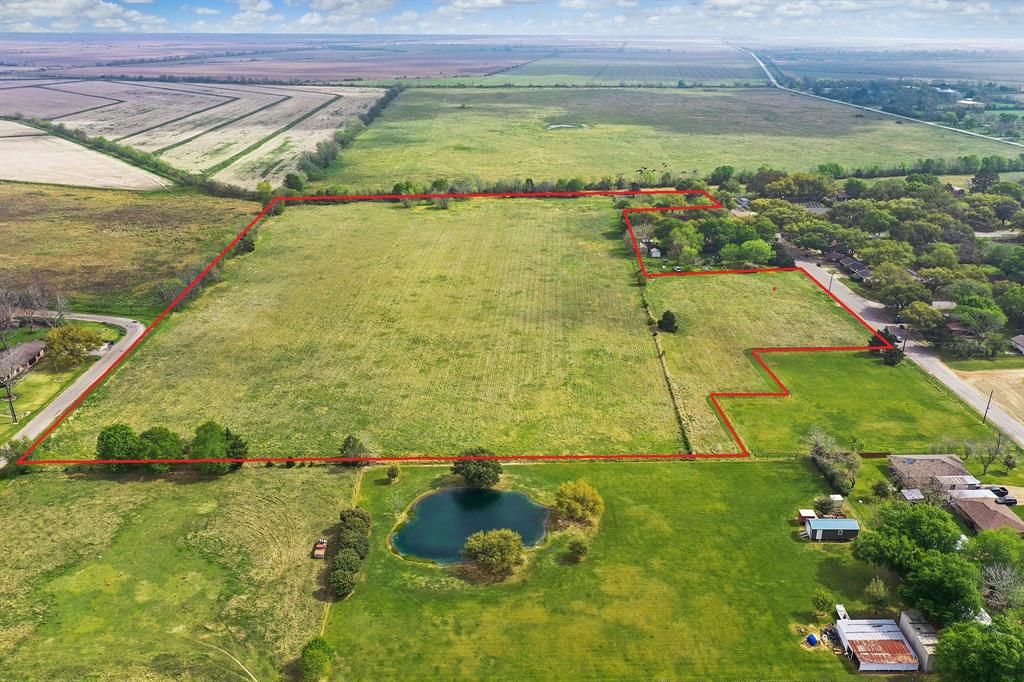 Great opportunity awaits with this 30 acre tract prime for development. There are access opportunities on both N. Austin Rd and Burns Avenue. This property offers many possibilities. Develop, Build a primary residence with plenty of space, keep your horses, graze cattle, etc. The possibilities are endless. There is an adjoining 102.88 acres also for sale. Not in flood zone.