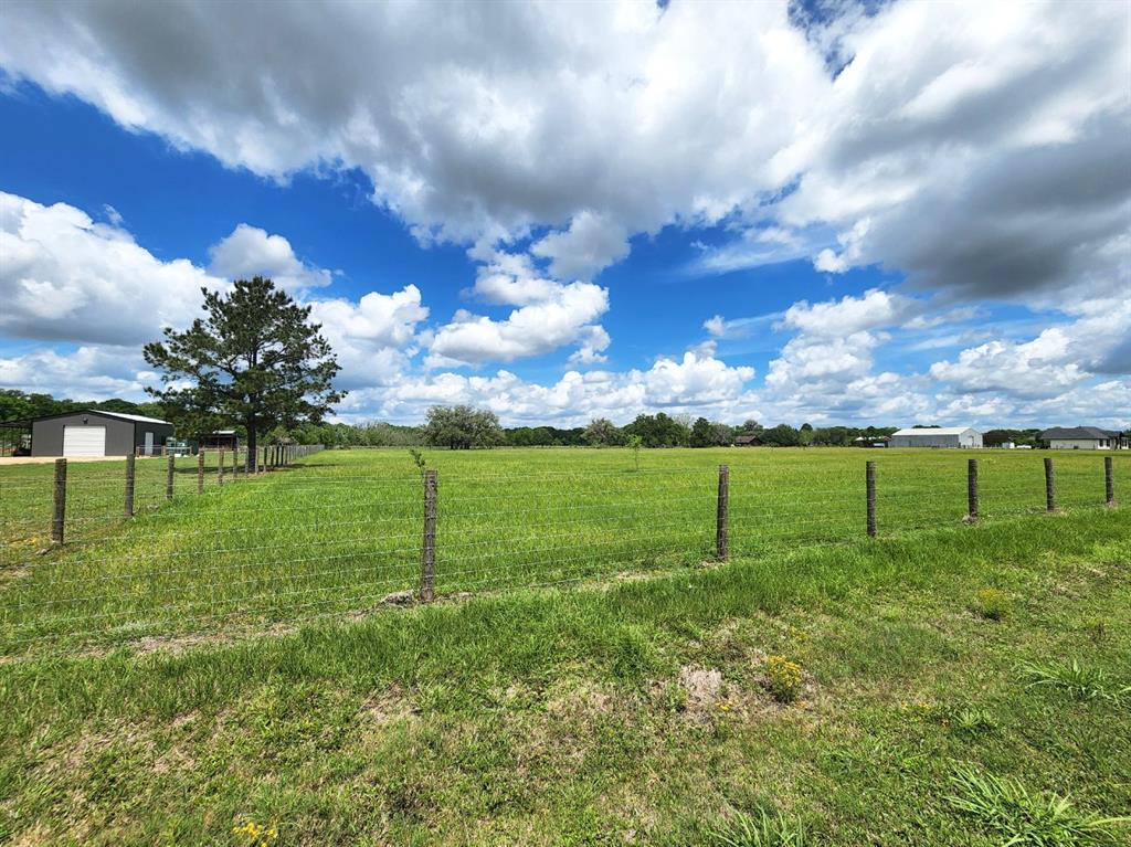 Gorgeous, cleared acreage ready for your dream home! High and dry and completely fenced! The secluded feel of this land will make you feel as if you are miles from town, without a long commute!