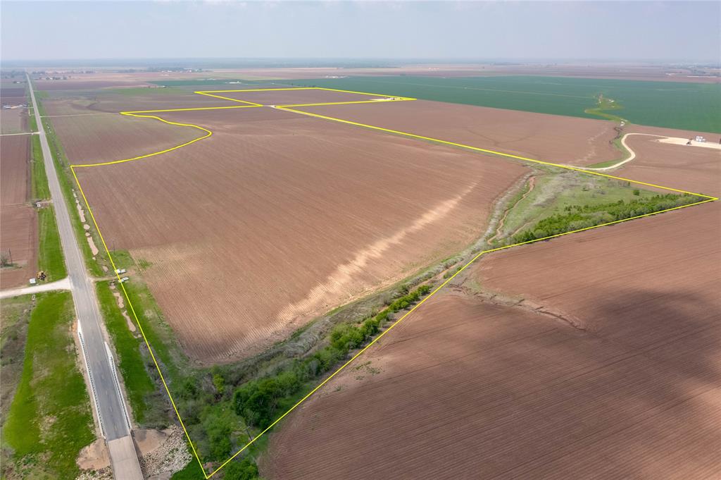 Located just minutes from HWY 6, this 170.813 acres of valuable farmland, which provides 1,790 feet of Sandy Point Road frontage, is currently functional with row crops of cotton and milo but is also amenable to grass generation thanks to the fertile and well-drained silty clay loam soil. There are two irrigation wells spaced evenly on the two tracts of land, the southerly piece being 98.48 acres and the more northerly piece consisting of 72.333 acres, with communicating road between the two pieces.