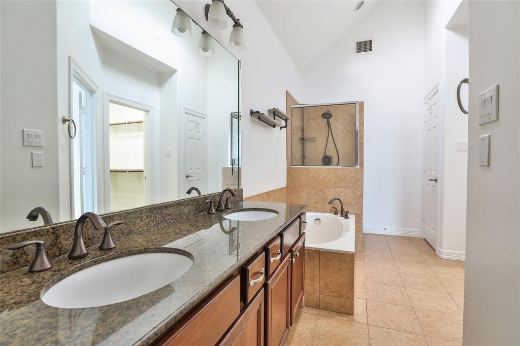 Double sinks in the primary en suite as well as granite counter tops.