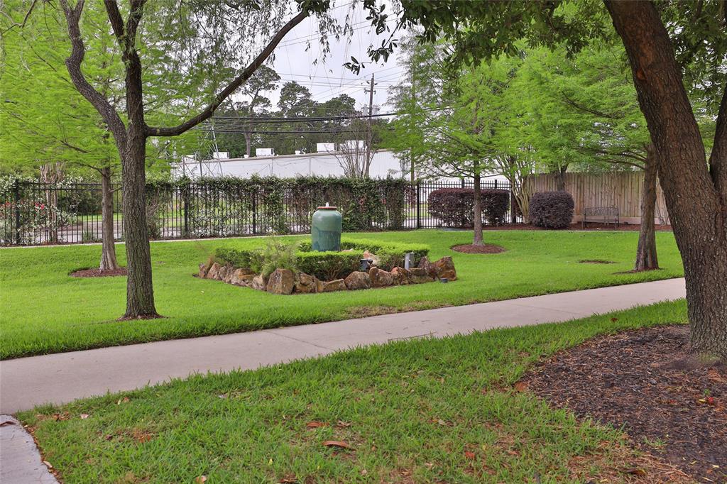 This property is unique in that there is a large green space and walking trail for all residents to use.