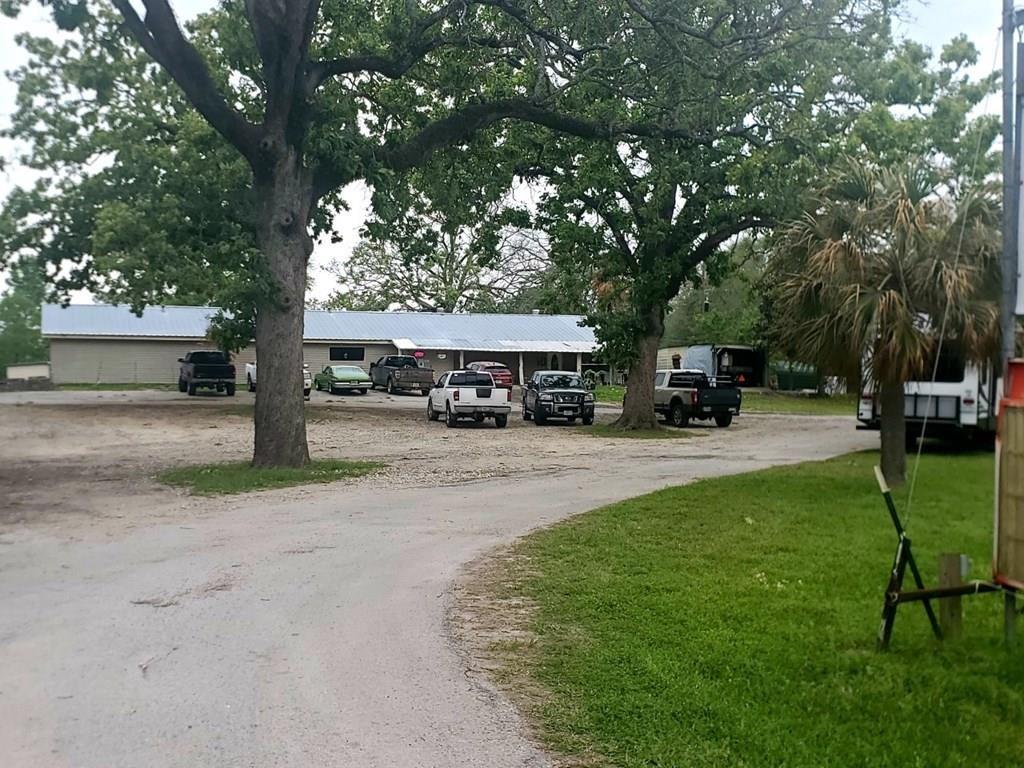 Great investment opportunity. Functioning bar and RV park on over 3 acres in the city of Groveton Texas. Bar area is roughly 40x80 and comes with all chairs, Tables, and Equipment used behind the bar such as coolers, cash register, etc. Property comes with bill of sale on two campers, currently renting for $400 and $450 each month. Six RV spots in total (renting for $250per month) with three in use at this time and five more that need updating. Large stocked pond and several extra buildings and carports that will convey with the property. Bar has two bed one bath apartment currently leased with a special contract. Open for business and income producing with Games, Pool, darts, and a ton of opportunity to expand. Renovate, Remodel, Repurpose, Add more RV spots, Bring in Tiny Home Community, Restaurant, Etc.