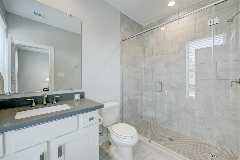 This gorgeous guest bath  is private to the prior bedroom.