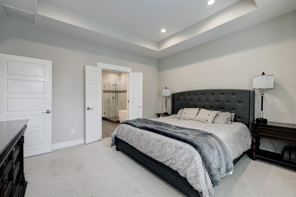 This is a king bed with plenty of room for nightstands, as well as a dresser.