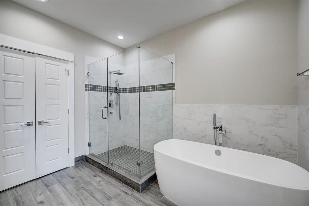The oversized frame-less glass shower and soaking tub are right out of a spa!