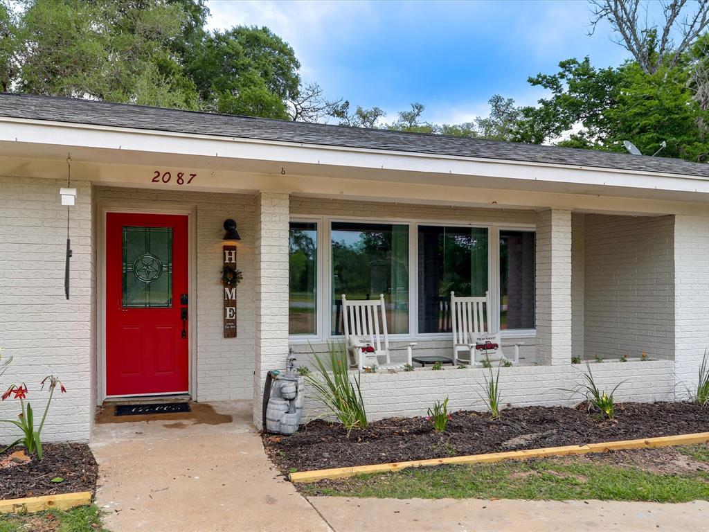2087 Highway 71 Columbus, Texas This stunning home sitting on almost 1.5 acres just a few miles outside Columbus and has been completely remodeled. Beautiful LVP flooring and shiplap throughout give the you a cozy countryside feel. The kitchen is complete with stainless steel appliances, abundant cabinet & drawer space, adorable breakfast nook, and durable concrete counters. The window over the farmhouse sink offers a distraction from dishes as you overlook the outdoors & vegetable garden in the backyard. The large primary retreat sits privately off of the living room & opens into the luxurious bathroom with spa-like shower & tub for soaking the day's stress away. Secondary bedrooms & bathroom will make guests feel right at home. The backyard is perfect for entertaining and enjoying warm summer nights, and what would a house in the country be without your very own chicken coop? This home is truly spectacular and you will be sure to fall in love at first sight! Please see attachments for full remodel details!