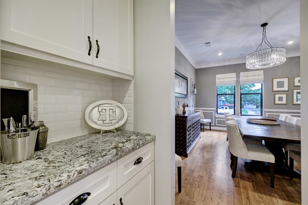 The butler's pantry leads from dining room to kitchen and includes a walk-in pantry.