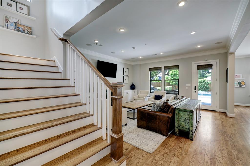 A gracious and light filled winding staircase at the end of the entry hall leads to the second floor.