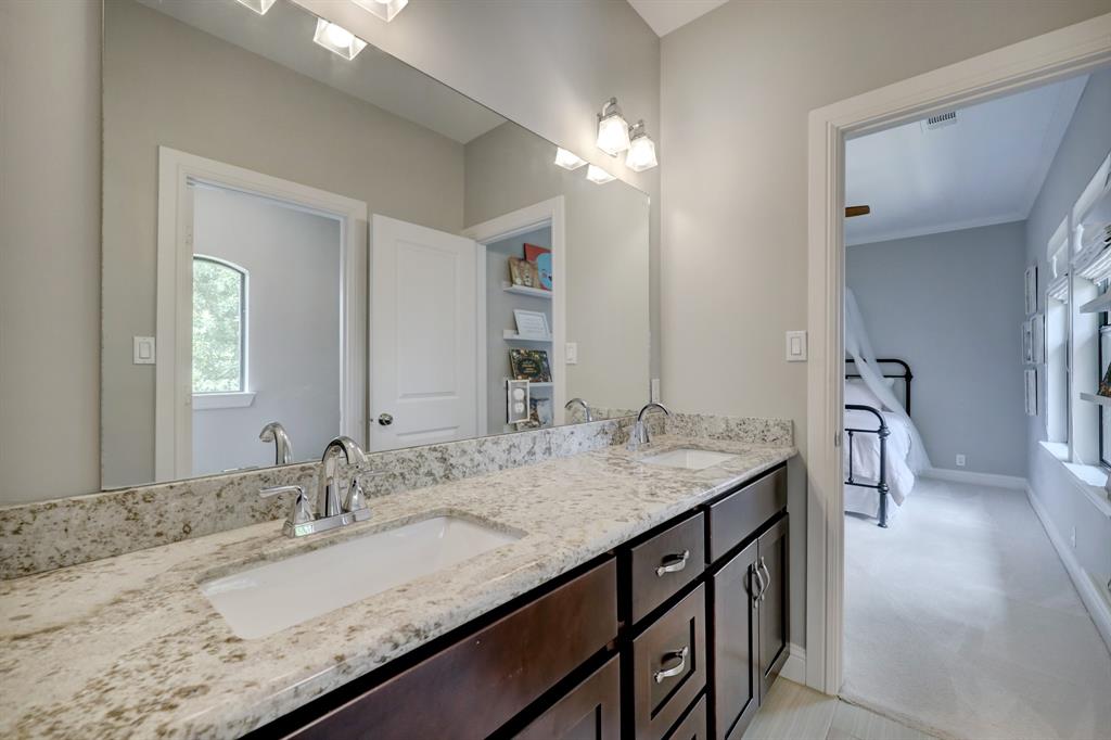 The shared bath on the second floor conveniently includes dual vanities.