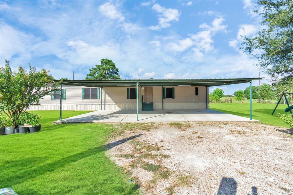 Come view this great looking home found minutes away from city of Sealy and even closer to I-10.  A charming single-wide mobile home offering 3 bed, with 2 full baths is waiting for you. Checkout the comfortable living room open to the kitchen and dining room space.  The master suite is found on one end while the secondary rooms are found on the opposite end of the home. Outside we have a large carport that fits 3 full-size vehicles.  This fully fenced, unrestricted property is just shy from being 1 full acre.  Being found in a cul-de-sac, this property gives access to a very wide frontage view of the road.  There is no HOA to worry about and a very low tax rate.  Home is on a conventional septic system and water well (pump recently replaced in March 2021.) Come view this great looking home today!!