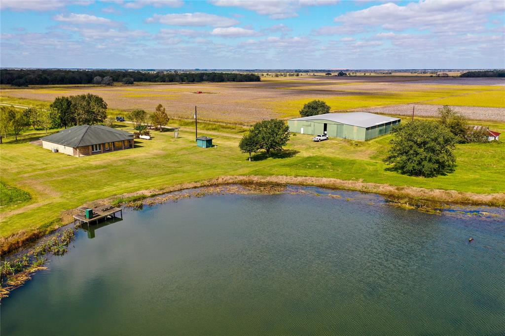 Beautiful newly remolded Home with 3/2/2.  Overlooking a Stocked Pond with Huge Catfish and Bass.  This property also has a 100x100 Barn with a 50 x 100 Slab, and a workshop area.  The property is in Needville ISD.