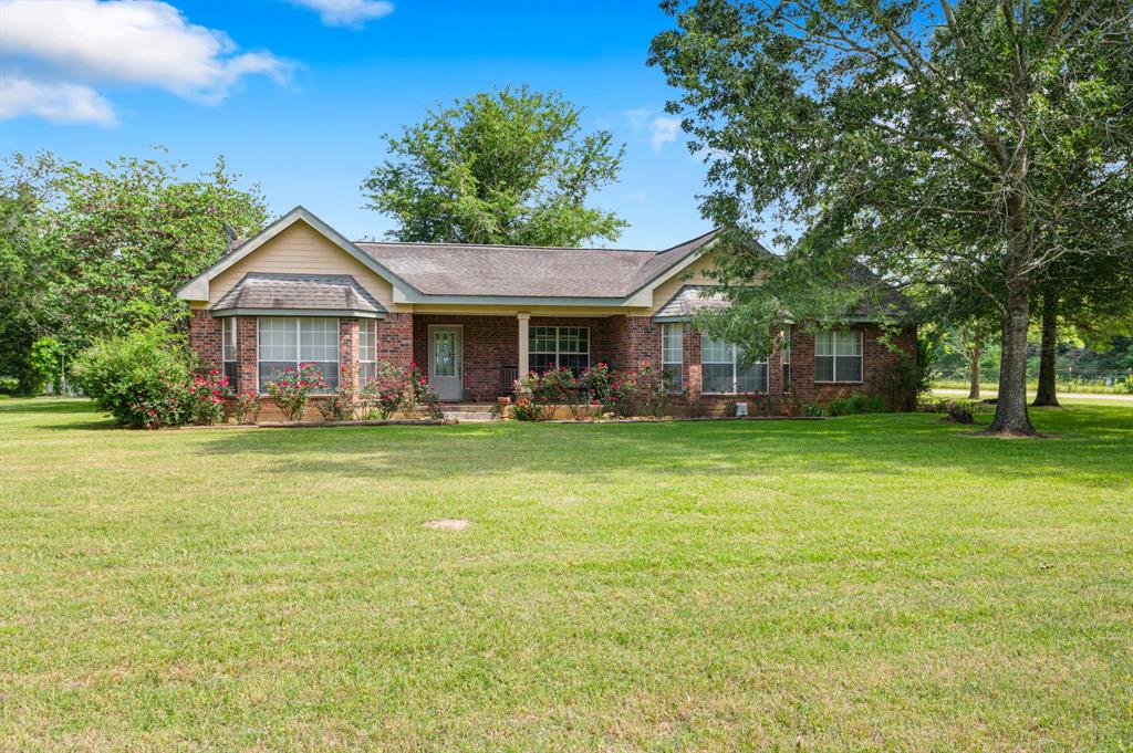 This exceptionally well-maintained three bedroom, two bath brick home sits on 19.896-acres, just outside Loop 304! The welcoming front porch leads you into an open living and dining area, perfect for entertaining. The enclosed garage offers additional living space, but its possibilities are endless. The large island kitchen with breakfast nook will impress the cook in the family with its abundance of custom cabinetry and great counter space. The handy laundry with utility sink offers good storage space. The spacious master suite has three closets and a private bath with his and her sinks, jacuzzi tub, and separate shower. The two guest bedrooms are nicely sized with good closet space and a share a hall bath with a shower/tub combo.  You will find a detached 2-car carport, RV cover, two metal shops  , and other small outbuildings. There is no shortage of storage space for your equipment and tools on this property! The pretty pastureland is perfect for livestock with a stock tank.
