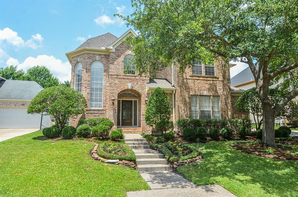Updated in sought after Lakes of Parkway. Short walk to area pool and tennis courts. Features include three car garage with workbench, covered patio, 2 wet bars, wine room with wine refrigerator, and wrought iron staircase. Bonus room could be 5th bedroom, exercise room, or hobby room. Kitchen has double pantry and built in refridgerator.