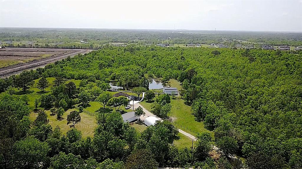 Here is your chance to own 24 acres in the booming area of Dickinson.  The home was fully remodeled in 2021 with gorgeous trimmings, newer barn/stable, big carport, 2 workshops, pavilion, pond, etc, etc.  Extremely private property without any neighbors, yet you can literally ride your ATV to the World Famous Buc-ee’s a few minutes away.  If your looking for acreage, this is a gem you must see.