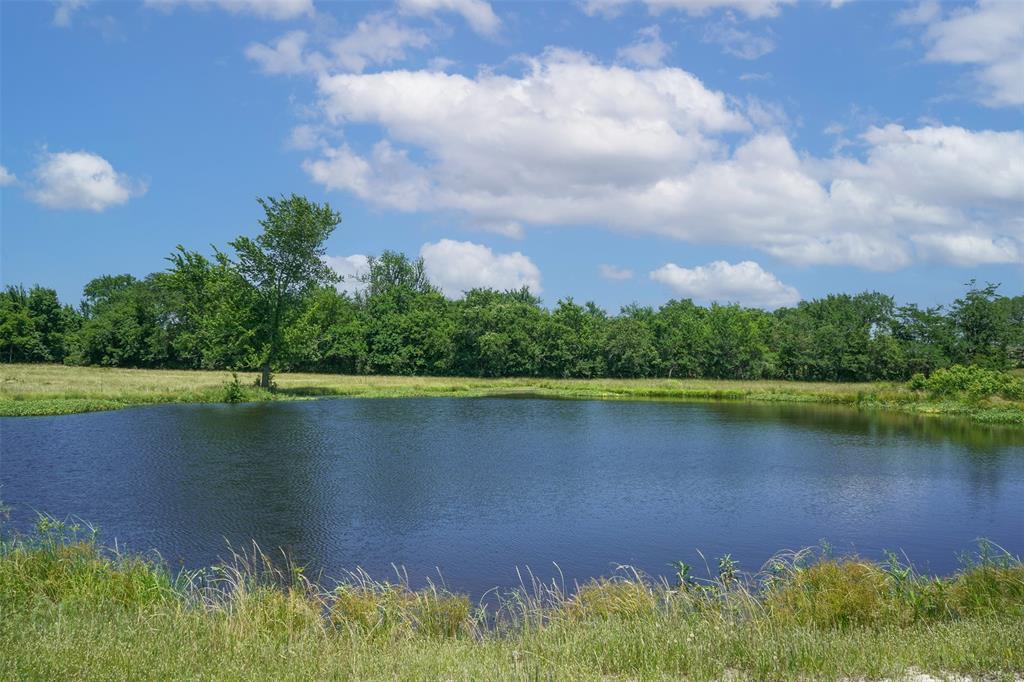 Beautiful 27 Acre tract located just off HWY 30 in the desired Anderson-Shiro ISD.   An Aggie Maroon pipe entrance welcomes you to the property where you will find a great mix of mature hardwoods and open pasture.  There are multiple great building sites throughout the property and the two ponds are great for fishing.  With easy access to HWY 30 you can be in College Station or Huntsville in 30 minutes.  Electric is available at the road. Possible to Divide