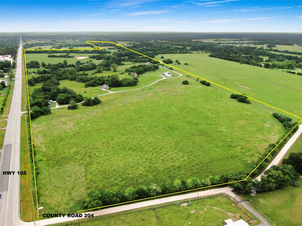 216 +/- acres on Highway 105 Between Montgomery and Navasota with over 4,200 ft of Highway frontage and frontage on CR 204. -3 Homes-4 Outbuildings - 3 homes build between 2005-2006, 1 manufactured home (can stay or be removed) - 2,976 sq ft brick home built 2006 (5 bedrooms/ 4.5 bathrooms including an exterior guest room. Inground pool w/spa) - 2,464 sq ft cement board home built 2005 (4 bedrooms) - 2,003 sq ft brick home built 2005 (3 bedrooms), Survey available - Fully fenced/cross fenced - 35X130 metal workshop (35x80 is enclosed), heated/cooled, stubbed for apartment. 3 barns/storage. Three pipe entrances, Main entrance has commercial grade opener with stone columns. Water well +  Dobbin Plantersville Water Service is tied into everything as a backup (Independently verify for your own needs/capacity for water). 
35 minutes to Interstate 45 -6 miles to Aggie Expressway - 15 minutes to Highway 6 - 20 minutes to Lake Conroe - 9 miles to the nearest chain grocery store and pharmacy
