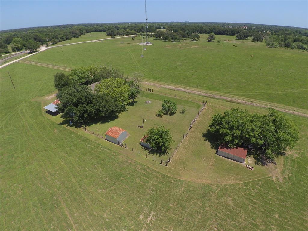 Fixer upper home home on over 12 beautiful acres just off Hwy 21 West near the Texas A&M Rellis Campus. Water well, natural gas, and a newer aerobic septic system. Would make a small ranchette, weekend retreat, or commercial application.