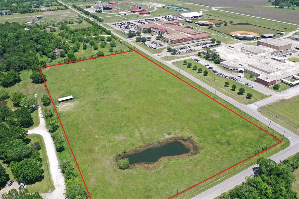 Mini Ranch, New Home Site, Industrial, or Commercial? 11+/- acres of fenced pasture land located at the corner of Huffman Eastgate RD and Willy Ln complete with barn and pond. Both Hargrave High school and Middle school are located across the street.  This multi-use tract has No MUD, NO HOA, and No Maintenance Fees. It has convenient access to FM 1960 and FM 2100. Just minutes away from Shopping in Atracsocita, Airport and the Newly completed Grand Pkway/99.