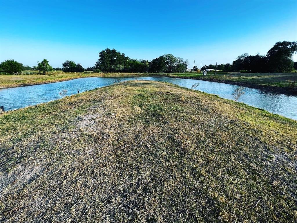 Ideally located between Schulenburg, Hallettsville, and Weimar and just 20 minutes from Interstate 10 with FM 318 frontage, this property is a perfect site for a home or weekend escape. Come build your dream home on this gorgeous 12. acres in Lavaca County!! The Property is completely fenced and Ag exempt with no flood plain. The property already has electricity, water well, county water and small barn/shed. Several build sites underneath the Huge Live Oak trees with views of the pond and to sit back and enjoy the sunsets.